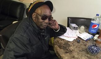 In this Monday, Nov. 27, 2017 photo, Zimbabwean dissident Thomas Mapfumo, Zimbabwe&#39;s most famous musician, pauses while speaking at his apartment in Eugene, Ore. As Zimbabweans celebrated the ouster of dictator Robert Mugabe, they danced on the streets to previously banned protest songs by one of the country’s most famous musicians, Mapfumo, a man jailed by the country’s former white rulers and hounded by the black government that succeeded them. (AP Photo/Andrew Selsky)