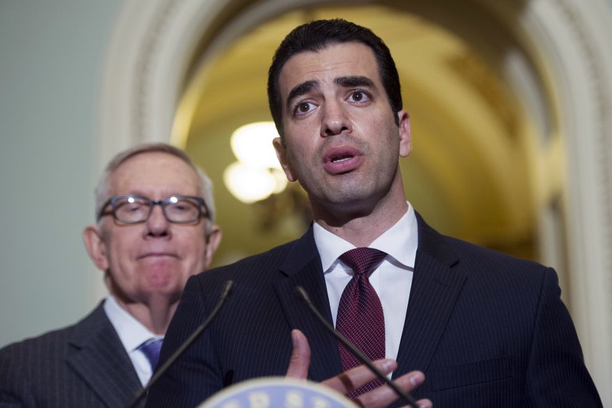 In this Nov. 14, 2016, photo Rep.-elect Ruben Kihuen (right), Nevada Democrat, speaks with reporters as Sen. Harry Reid, D-Nev., left, listens on Capitol Hill in Washington. The chairman of the House Democrats' campaign committee called on Kihuen to step down after a report Friday, Dec. 1, 2017, that he allegedly sexually harassed his campaign's finance director. (AP Photo/Cliff Owen) **FILE**