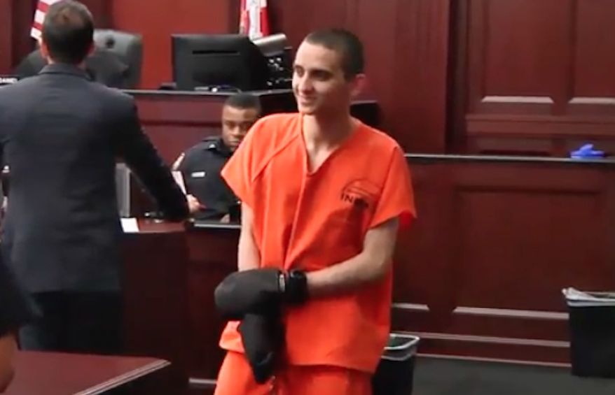 A Florida police officer who was shot three times during a traffic stop in 2016 taunted his attempted killer, 21-year-old Kevin Rojas, pictured here, with a bottle of personal lubricant during his sentencing Wednesday. (WJXT via The Miami Herald)