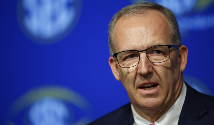 SEC Commissioner Greg Sankey speaks with the media during an NCAA college football news conference for the Southeastern Conference championship game at the Mercedes-Benz Stadium in Atlanta, Friday, Dec. 1, 2017. Auburn and Georgia meet on Saturday for the SEC title. (Joshua L. Jones,/Athens Banner-Herald via AP)