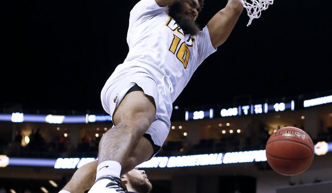FILE - In this Saturday, March 11, 2017, file photo, VCU&#x27;s Jonathan Williams dunks after getting by Richmond&#x27;s Nick Sherod (5) during the first half of an NCAA college basketball game in the Atlantic 10 tournament semifinals in Pittsburgh. Blessed with a lightning-quick first step, the strength and agility of a running back and the ability to shoot with both hands from in close, Williams has spent the past two seasons using penetration to produce points for the Rams. (AP Photo/Keith Srakocic, File)