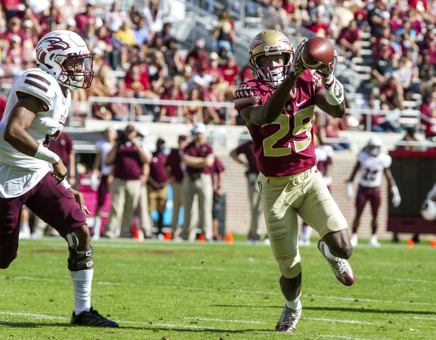 Florida State wide receiver D.J. Matthews (29) makes his first touchdown catch in front of Louisiana Monroe cornerback Marcus Hubbard during the first half of an NCAA college football game in Tallahassee, Fla., Saturday, Dec. 2, 2017. (AP Photo/Mark Wallheiser)
