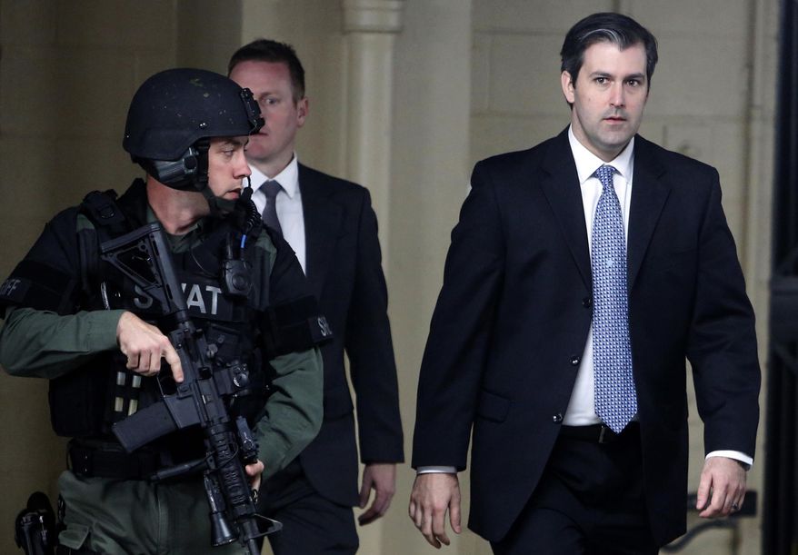 FILE - In this Monday, Dec. 5, 2016, file photo, former South Carolina police officer Michael Slager, right, walks from the Charleston County Courthouse under the protection of the Charleston County Sheriff&#x27;s Department after a mistrial was declared for his trial in Charleston, S.C.  l Slager is in court Monday, Dec. 4, 2017, facing a possible life sentence for the April 2015 shooting death of Walter Scott. The foot chase and shooting were captured by a bystander on cellphone video that was seen by millions online. Slager pleaded guilty in May to violating Scott&#x27;s civil rights. A state jury deadlocked last year on murder charges, which were dropped as part of his federal plea deal. (AP Photo/Mic Smith, File)