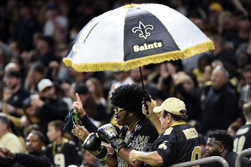 New Orleans Saints fans cheer in the second half of an NFL football game against the Carolina Panthers in New Orleans, Sunday, Dec. 3, 2017. (AP Photo/Bill Feig)