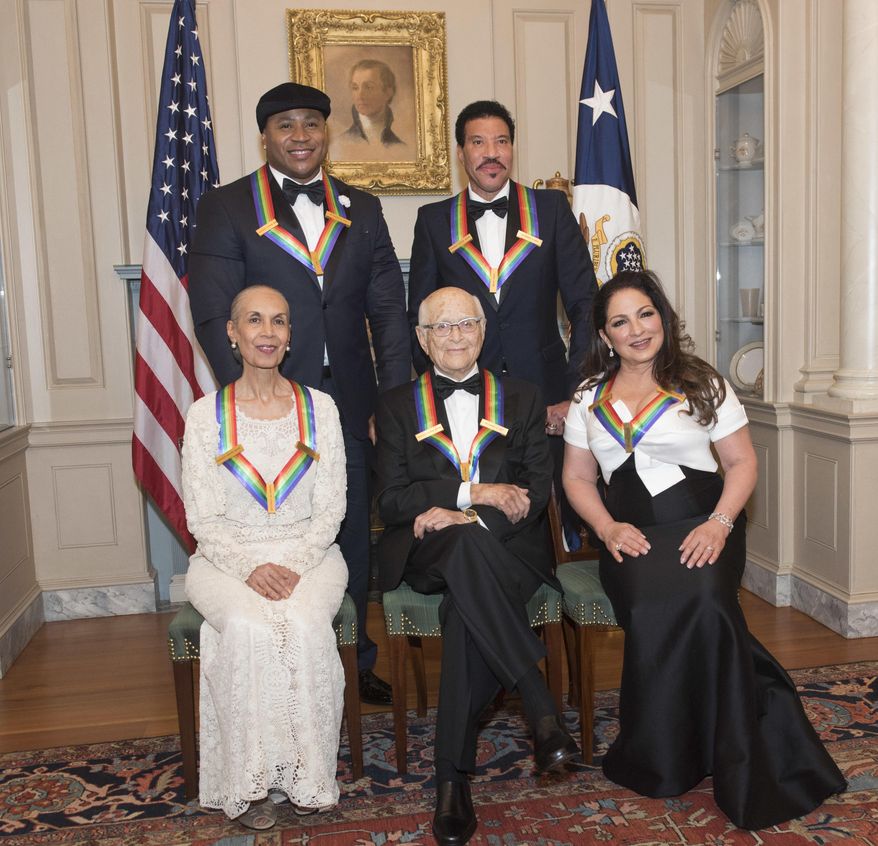 Front row from left, 2017 Kennedy Center Honorees Carmen de Lavallade, Norman Lear, Gloria Estefan, back row from left, LL Cool J, and Lionel Richie are photographed following the State Department dinner for the Kennedy Center Honors, Saturday, Dec. 2, 2017, in Washington. (AP Photo/Kevin Wolf)