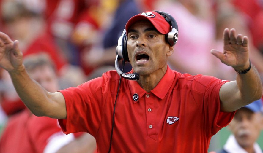 FILE - In this Nov. 2, 2008, file photo, Kansas City Chiefs coach Herm Edwards yells instructions to his team during an NFL football game against the Tampa Bay Buccaneers in Kansas City, Mo. Arizona State has hired former NFL coach and ESPN analyst Edwards as its football coach. The school announced the hiring Sunday night, Dec. 3, 2017, and will hold a news conference introducing Edwards on Monday morning. (AP Photo/Charlie Riedel, File) **FILE**