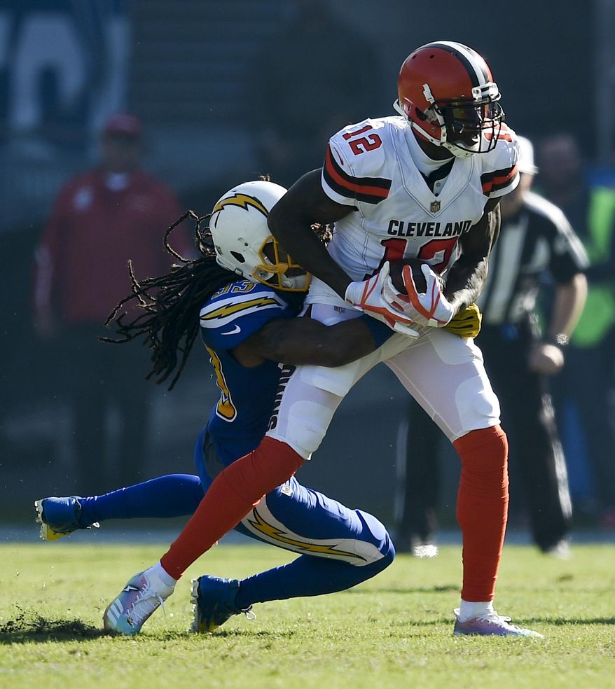 Cleveland Browns wide receiver Josh Gordon, right, is tackled by Los Angeles Chargers free safety Tre Boston during the first half of an NFL football game Sunday, Dec. 3, 2017, in Carson, Calif. (AP Photo/Kelvin Kuo)