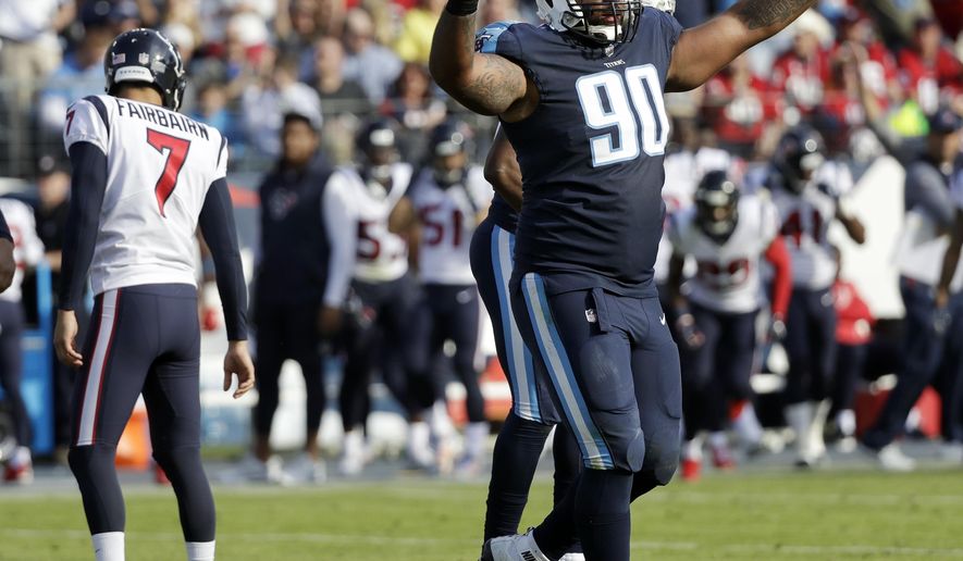 Tennessee Titans defensive end DaQuan Jones (90) celebrates after a 48-yard field goal attempt by Houston Texans kicker Ka'imi Fairbairn (7) was no good in the first half of an NFL football game Sunday, Dec. 3, 2017, in Nashville, Tenn. (AP Photo/James Kenney)
