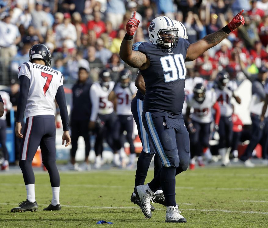 Tennessee Titans defensive end DaQuan Jones (90) celebrates after a 48-yard field goal attempt by Houston Texans kicker Ka'imi Fairbairn (7) was no good in the first half of an NFL football game Sunday, Dec. 3, 2017, in Nashville, Tenn. (AP Photo/James Kenney)