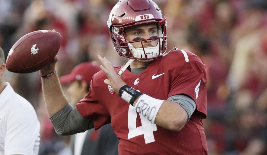 FILE - In this Sept. 2, 2017, file photo, Washington State quarterback Luke Falk warms up for an NCAA college football game against Montana State in Pullman, Wash. Falk won the Burlsworth Award, Monday, Dec. 4, 2017, given annually to the top college football player who began his career as a walk-on. (AP Photo/Young Kwak, File)
