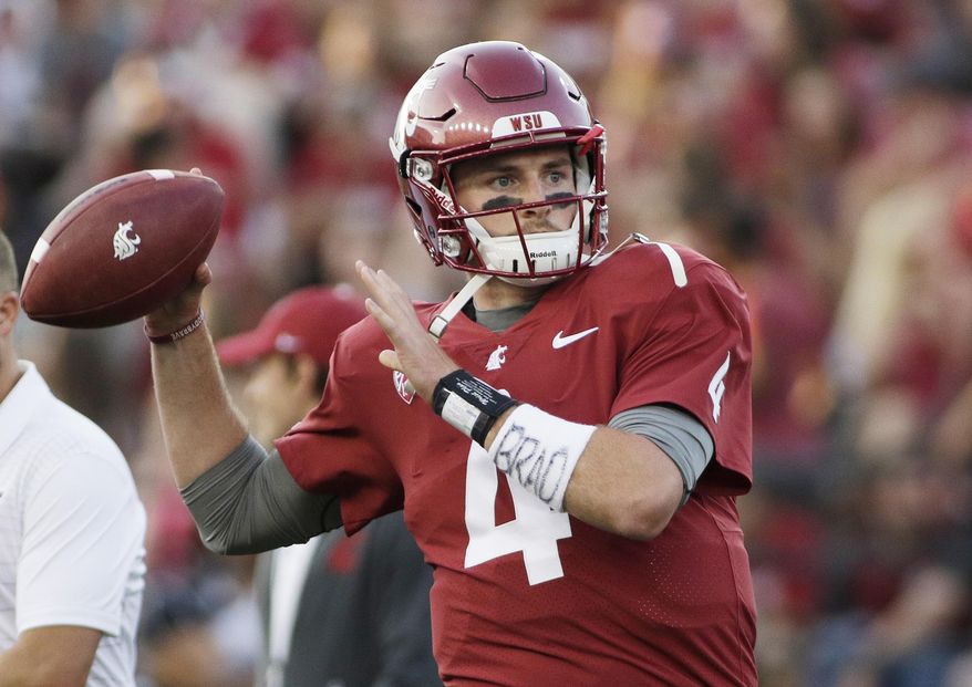 FILE - In this Sept. 2, 2017, file photo, Washington State quarterback Luke Falk warms up for an NCAA college football game against Montana State in Pullman, Wash. Falk won the Burlsworth Award, Monday, Dec. 4, 2017, given annually to the top college football player who began his career as a walk-on. (AP Photo/Young Kwak, File)