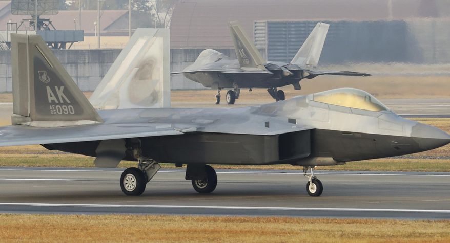 CORRECTS TO REMOVE REFERENCE TO BIGGEST-EVER JOINT EXERCISE - U.S. Air Force F-22 Raptors taxi on the runway upon landing at a South Korean air base in Gwangju, South Korea, Monday, Dec. 4, 2017. The United States and South Korea have started their joint air force exercise with hundreds of aircrafts including two dozen stealth jets. (Yonhap via AP)