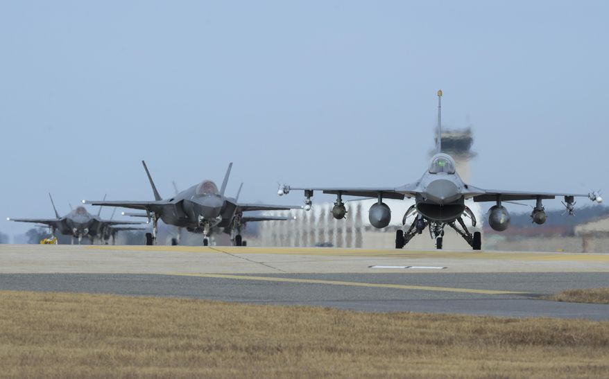 In this Sunday, Dec. 3, 2017, photo provided by U.S. Air Force, a U.S. Air Force F-16 Fighting Falcon, right, and F-35A Lightning IIs assigned to the 34th Expeditionary Fighter Squadron Hill Air Force Base, Utah, taxi toward the end of the runway during the exercise VIGILANT ACE 18 at Kunsan Air Base, South Korea. Hundreds of aircraft including two dozen stealth jets began training Monday, Dec. 4, 2017, as the United States and South Korea launched their biggest-ever combined air force exercise. (Senior Airman Colby L. Hardin/U.S. Air Force photo via AP) **FILE**