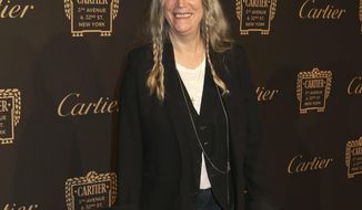 FILE - In this Sept. 7, 2016 file photo, Patti Smith attends the Cartier Fifth Avenue Mansion grand reopening celebration in New York. Smith and Salman Rushdie have compared notes on everything from the writing process to how they cope in the age of President Donald Trump. (Photo by Greg Allen/Invision/AP, File)