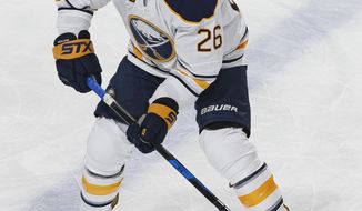 FILE - In this April 8, 2017, file photo, Buffalo Sabres left wing Matt Moulson (26) skates prior to an NHL hockey game against the Florida Panthers, in Sunrise, Fla.  The Buffalo Sabres are shaking up their underachieving roster by placing forward Matt Moulson on waivers and acquiring forward Scott Wilson in a trade with the Detroit Red Wings. (AP Photo/Joel Auerbach, File)