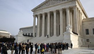 People stand in line to enter the Supreme Court where a case on sports betting is being heard, Monday, Dec. 4, 2017, in Washington. (AP Photo/Jacquelyn Martin)