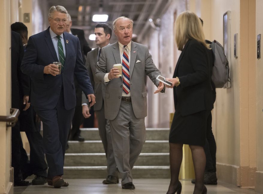 Rep. Rodney Frelinghuysen, R-N.J., chairman of the House Appropriations Committee, center, joined at left by Rep. Rick Allen R-Ga., arrives with fellow House Republicans for a closed-door strategy session on Capitol Hill in Washington, Tuesday, Dec. 5, 2017. (AP Photo/J. Scott Applewhite) ** FILE **