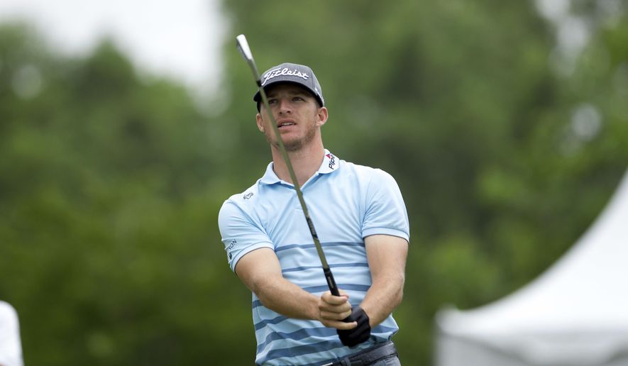 In this Sunday, April 30, 2017 file photo, Morgan Hoffmann tees off on the third hole during the final round of the PGA Zurich Classic golf tournament&#39;s new two-man team format at TPC Louisiana in Avondale, La.  Hoffmann revealed in The Players’ Tribune that he has been diagnosed with muscular dystrophy that already has cost him his right pectoral muscle. (AP Photo/Scott Threlkeld, File)