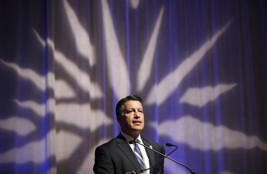 Nevada Gov. Brian Sandoval speaks at the Governor's Global Tourism Summit, Tuesday, Dec. 5, 2017, in Las Vegas. (AP Photo/John Locher)