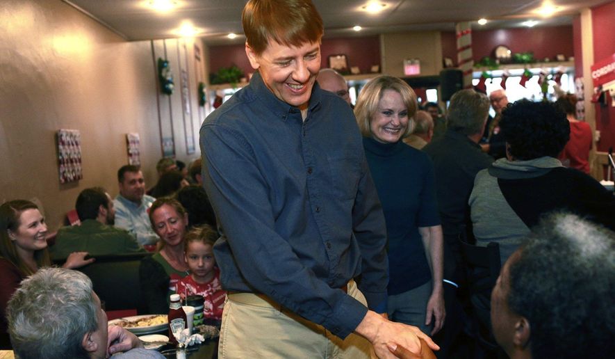 Former director of the Consumer Financial Protection Bureau Richard Cordray shakes hands after announcing he is a Democratic candidate for Ohio governor Tuesday, Dec. 5, 2017, at "Lilly's Kitchen Table" Restaurant in Grove City, Ohio. Cordray chose his hometown of Grove City for his announcement. (Brooke LaValley/The Columbus Dispatch via AP)