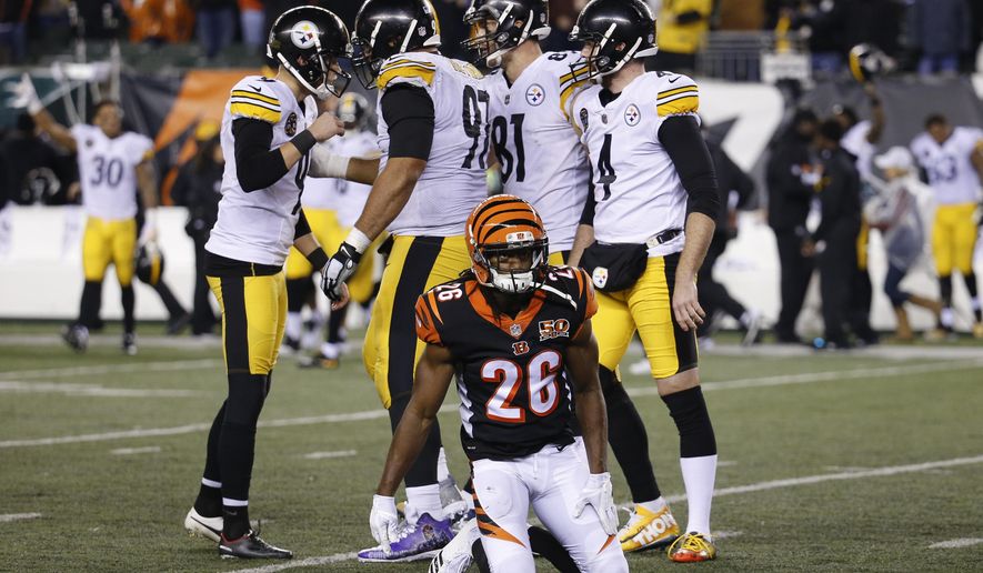 Pittsburgh Steelers kicker Chris Boswell, left, celebrates his game-winning field goal alongside Cincinnati Bengals cornerback Josh Shaw (26) in the second half of an NFL football game, Monday, Dec. 4, 2017, in Cincinnati. The Steelers won 23-20. (AP Photo/Frank Victores)