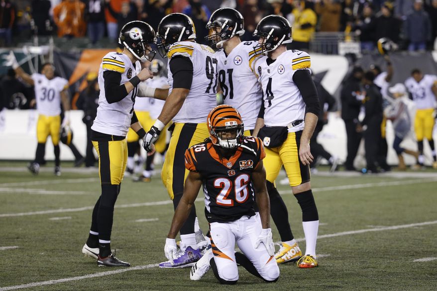 Pittsburgh Steelers kicker Chris Boswell, left, celebrates his game-winning field goal alongside Cincinnati Bengals cornerback Josh Shaw (26) in the second half of an NFL football game, Monday, Dec. 4, 2017, in Cincinnati. The Steelers won 23-20. (AP Photo/Frank Victores)