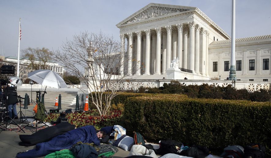 People sleep outside of the Supreme Court in order to save places in line for Dec. 5 arguments in &#x27;Masterpiece Cakeshop v. Colorado Civil Rights Commission,&#x27; Monday, Dec. 4, 2017, outside of the Supreme Court in Washington. (AP Photo/Jacquelyn Martin)