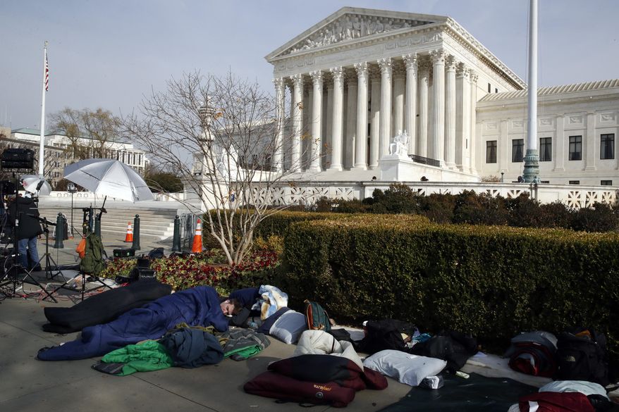 People sleep outside of the Supreme Court in order to save places in line for Dec. 5 arguments in &#x27;Masterpiece Cakeshop v. Colorado Civil Rights Commission,&#x27; Monday, Dec. 4, 2017, outside of the Supreme Court in Washington. (AP Photo/Jacquelyn Martin)