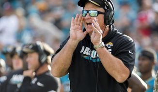 FILE - In this Nov. 5, 2017, file photo, Jacksonville Jaguars head coach Doug Marrone shouts a players from the sidelines during the second half of an NFL football game against the Cincinnati Bengals in Jacksonville, Fla. After coach Marrone disclosed his love of bologna and cheese sandwiches, the National Hot Dog and Sausage Council sent 100 logs of beef bologna to the stadium. (AP Photo/Stephen B. Morton, File)