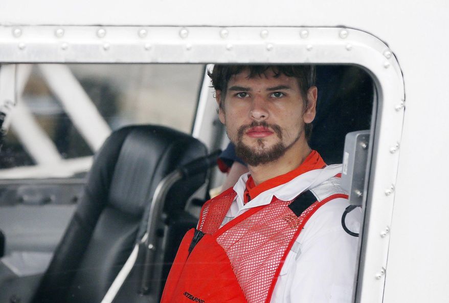 FILE - This Sept. 27, 2016 file photo shows Nathan Carman arriving in a small boat at the US Coast Guard station in Boston. Carman's family filed a lawsuit in New Hampshire on Monday, July 17, 2017 accusing him of killing his grandfather and possibly his mother, who was lost at sea during a mother-son fishing trip. Carman denies in court papers allegations that he killed his millionaire grandfather in 2013. (AP Photo/Michael Dwyer)