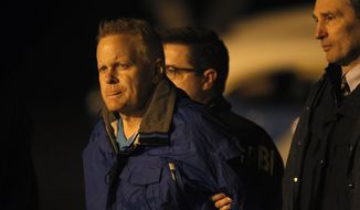 Fugitive lawyer Eric Conn is taken into custody by FBI agents on the tarmac at Blue Grass Airport in Lexington, Ky., Tuesday, Dec. 5, 2017. Conn, who spent six months on the run after pleading guilty in a $500 million Social Security fraud scheme, was being flown back to Kentucky on Tuesday after he was caught outside a Pizza Hut in Honduras. (AP Photo/Matt Goins)