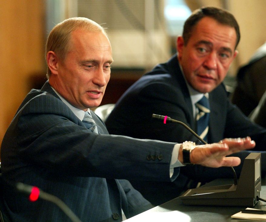 Mikhail Lesin (right) served as a top press aide to Russian President Vladimir Putin until 2009. As his broadcast network RT expanded, he had a falling-out with Mr. Putin, one American intelligence source said, and he moved his family to California. (REUTERS/ITAR-TASS/KREMLIN PRESS SERVICE)