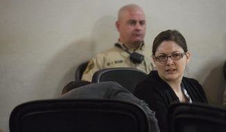 Nicole Finn, of West Des Moines, talks to her attorney Thomas Augustine during Finn&#x27;s trial for murder, kidnapping and child endangerment on Wednesday, Dec. 6, 2017, at the Polk County Courthouse. (Kelsey Kremer/The Des Moines Register via AP)