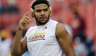 FILE - In this Oct. 29, 2017, file photo, Washington Redskins tight end Jordan Reed reaches for his headphones during warm ups before an NFL football game against the Dallas Cowboys in Landover, Md. Reed is going through the most difficult time of his life as he endures another injury-plagued season. Arguably the Redskins&#39; most effective playmaker, Reed is in danger of missing his sixth consecutive game with a strained hamstring. (AP Photo/Mark Tenally) ** FILE **