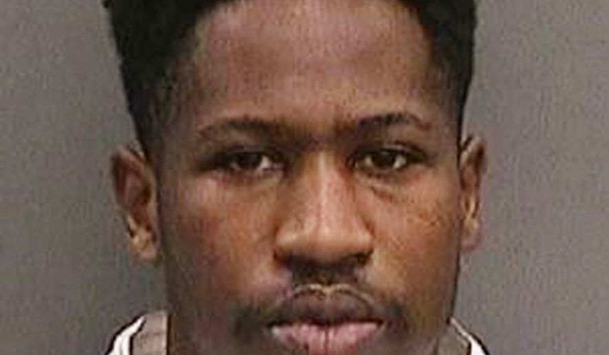 FILE - This file booking photo provided by the Tampa Police Department, Fla., on Wednesday, Nov. 29, 2017, shows Howell Emanuel Donaldson, the suspect in a string of four slayings that terrorized a Tampa neighborhood. The parents of Donaldson will go before a judge Thursday, Dec. 7, 2017, after refusing to answer questions about their son. The Tampa Bay Times reports investigators wanted to question Howell Donaldson Jr. and Rosita Donaldson on Tuesday about Howell Emanuel Donaldson III’s background, developmental history, gun possession and state of mind. But they refused, revealing only the names, addresses and birth dates of family members. (Tampa Police Department via AP, File)