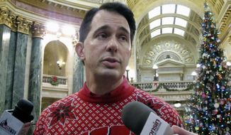 Wisconsin Gov. Scott Walker and dozens of his Republican allies had their email messages seized. State Attorney General Brad Schimel is recommending disciplinary action, but no criminal charges. (Associated Press/File)