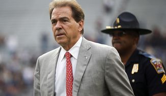 FILE - In this Nov. 25, 2017, file photo, Alabama head coach Nick Saban walks the field before the Iron Bowl NCAA college football game against Auburn, in Auburn, Ala. Write-in votes could help decide Alabama’s Senate race between Republican Roy Moore and Democrat Doug Jones. Saban often gets write-in votes in state elections.  (AP Photo/Brynn Anderson, File)