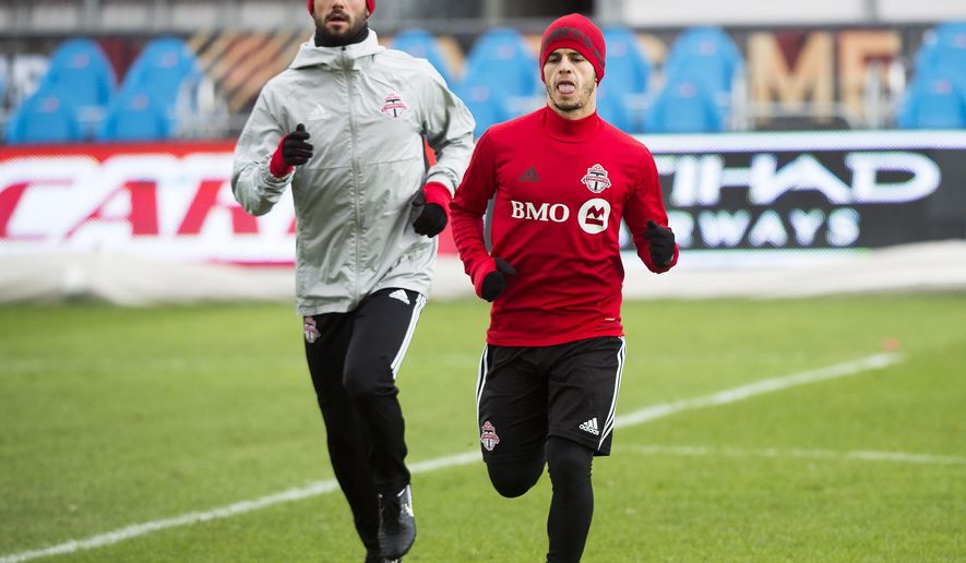 Toronto FC midfielder Victor Vazquez, left, and forward Sebastian Giovinco warm up during practice ahead of the MLS Cup soccer final against the Seattle Sounders, in Toronto, Friday, Dec. 8, 2017. (Nathan Denette/The Canadian Press via AP)