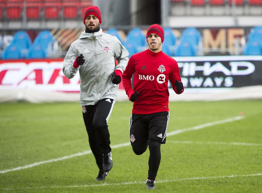 Toronto FC midfielder Victor Vazquez, left, and forward Sebastian Giovinco warm up during practice ahead of the MLS Cup soccer final against the Seattle Sounders, in Toronto, Friday, Dec. 8, 2017. (Nathan Denette/The Canadian Press via AP)