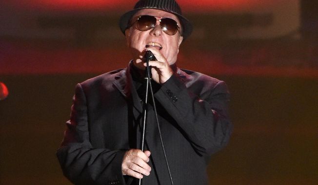 FILE - In this June 18, 2015 file photo, Van Morrison performs at the 46th annual Songwriters Hall of Fame Induction and Awards Gala in New York. Morrison’s 38th studio album, “Versatile,” comes hard on the heels of “Roll With the Punches,” a tribute to the rhythm and blues influences that helped forge the style that made him one of the world’s greatest songwriters.  (Photo by Evan Agostini/Invision/AP, File)