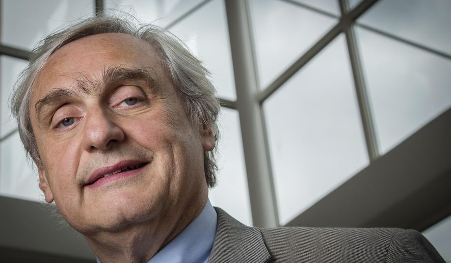 FILE - In this July 24, 2014, file photo, then-Chief Judge of the U.S. Court of Appeals for the Ninth Circuit Alex Kozinski poses for a portrait in the lobby of a Washington office building. Six women who served as clerks or externs at the U.S. 9th Circuit Court of Appeals allege to The Washington Post that judge Alex Kozinski subjected them to inappropriate sexual comments or conduct, including asking them to watch pornography in his chambers, the newspaper reported Friday, Dec. 8, 2017. (AP Photo/J. David Ake, File)