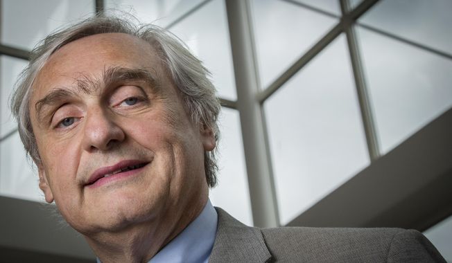 FILE - In this July 24, 2014, file photo, then-Chief Judge of the U.S. Court of Appeals for the Ninth Circuit Alex Kozinski poses for a portrait in the lobby of a Washington office building. Six women who served as clerks or externs at the U.S. 9th Circuit Court of Appeals allege to The Washington Post that judge Alex Kozinski subjected them to inappropriate sexual comments or conduct, including asking them to watch pornography in his chambers, the newspaper reported Friday, Dec. 8, 2017. (AP Photo/J. David Ake, File)