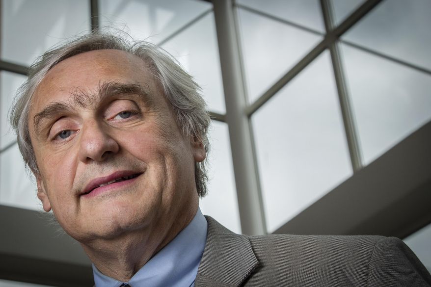 FILE - In this July 24, 2014, file photo, then-Chief Judge of the U.S. Court of Appeals for the Ninth Circuit Alex Kozinski poses for a portrait in the lobby of a Washington office building. Six women who served as clerks or externs at the U.S. 9th Circuit Court of Appeals allege to The Washington Post that judge Alex Kozinski subjected them to inappropriate sexual comments or conduct, including asking them to watch pornography in his chambers, the newspaper reported Friday, Dec. 8, 2017. (AP Photo/J. David Ake, File)