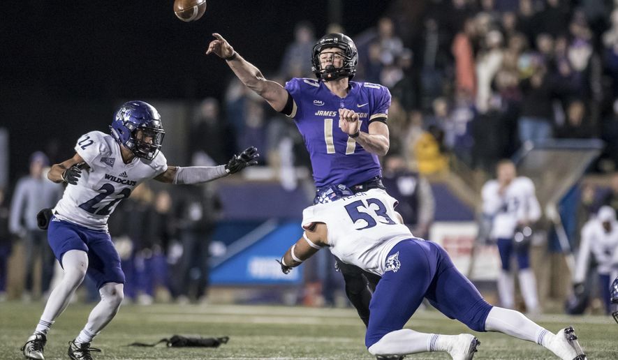 James Madison quarterback Bryan Schor (17) throws a pass as Weber State linebacker Auston Tesch (53) tries to make the sack during the second half of an NCAA college football game in the quarterfinals of the FCS playoffs Friday, Dec. 8, 2017, in Harrisonburg, Va. James Madison won 31-28. (Daniel Lin/Daily News-Record via AP)