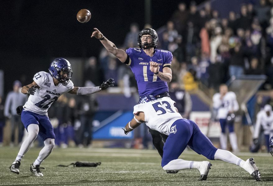 James Madison quarterback Bryan Schor (17) throws a pass as Weber State linebacker Auston Tesch (53) tries to make the sack during the second half of an NCAA college football game in the quarterfinals of the FCS playoffs Friday, Dec. 8, 2017, in Harrisonburg, Va. James Madison won 31-28. (Daniel Lin/Daily News-Record via AP)