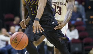 Texas A&amp;amp;M guard Duane Wilson (13) knocks the ball away from Prairie View A&amp;amp;M forward Zachary Hamilton during the second half of an NCAA college basketball game Saturday, Dec. 9, 2017, in College Station, Texas. (AP Photo/Sam Craft)
