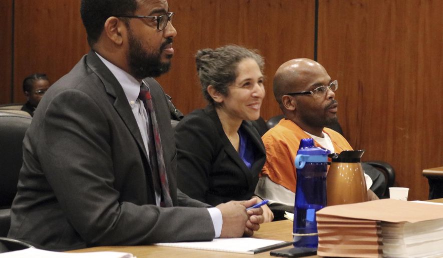This photo provided by the Northern California Innocence Project shows Zavion Johnson, right, with members of his legal team in court in Sacramento, Calif., Friday, Dec. 8, 2017. Fifteen years after Johnson received a life sentence for the shaking death of his 4-month-old daughter, he's set to walk out of prison amid controversy over the medical experts' testimony that convicted him. Sacramento County Superior Court Judge James Arguelles set aside Johnson's second-degree murder conviction on Friday, after prosecutors agreed that current medical science wouldn't support his conviction. (Lori Reinauer/Northern California Innocence Project via AP)