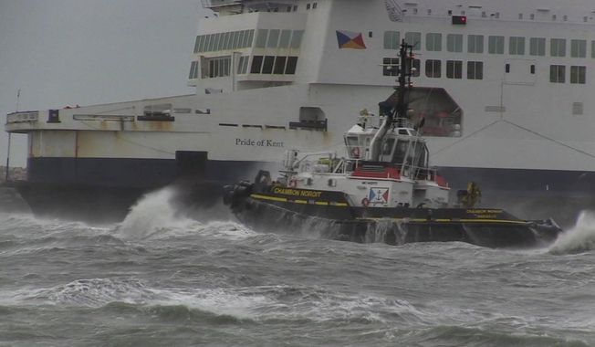 In this grab taken from video, a tug boat tries to tow The Pride of Kent ferry, in Calais, France, Sunday, Dec. 10, 2017.  Authorities prepared the emergency evacuation of a ferry carrying 313 people that ran aground at the French port city of Calais Sunday interrupting boat traffic across the English Channel, according to authorities. (AP)