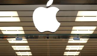 FILE - This Thursday, Sept. 19, 2013, file photo shows the Apple logo above a store location entrance in Dallas. Apple has bought Shazam, the maker of a song-recognition app that Apple&#x27;s digital assistant Siri has already been using to help people identify the music playing on their iPhones. (AP Photo/Tony Gutierrez, File)