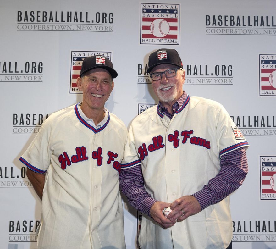 Newly elected Hall of Famers Alan Trammell, left, and Jack Morris, right, pose for photos in their new Hall of Fame jerseys during the Major League Baseball winter meetings in Orlando, Fla., Monday, Dec. 11, 2017. (AP Photo/Willie J. Allen Jr.)